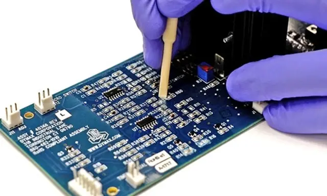 ELPEGUARD acrylic conformal coating being selectively removed from a PCB for rework, EMS Technologies