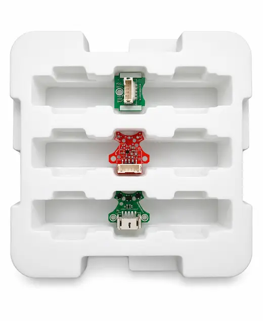 White thermoformed tray with three populated circuit boards seated in moulded pockets, EMS Technologies