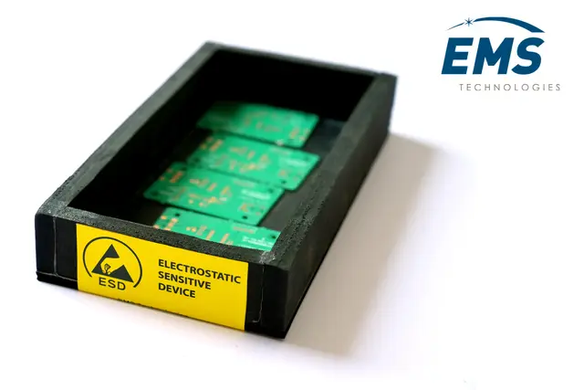 ESD-safe EVA storage bin holding assembled PCBs, labelled for electrostatic-sensitive devices