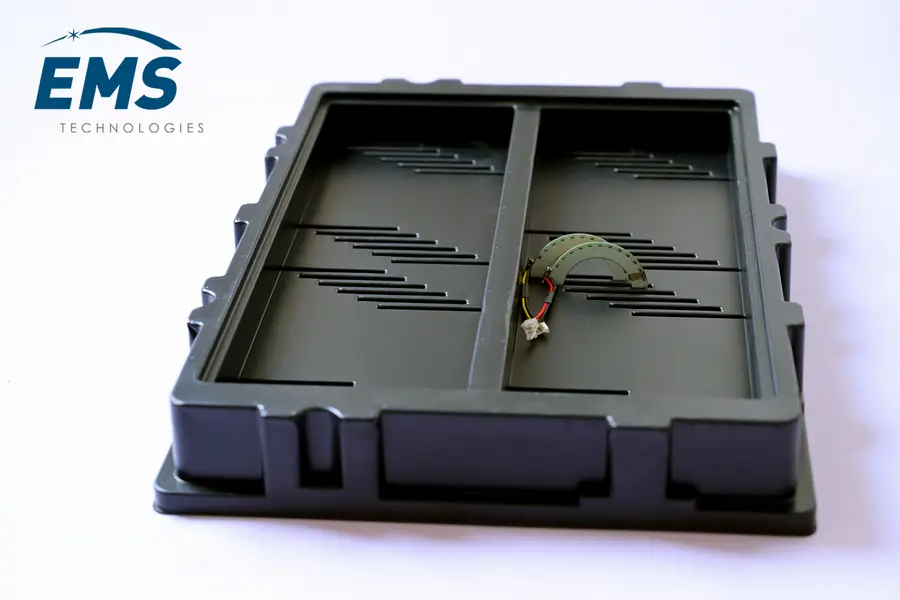 Custom ESD thermoformed tray with cavities matched to component geometry, EMS Technologies